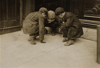 LEWIS W. HINE (1874-1940) Children playing with Campbell kid dolls * Mill boys pitching pennies on Main St. in the afternoon, Fall Rive
